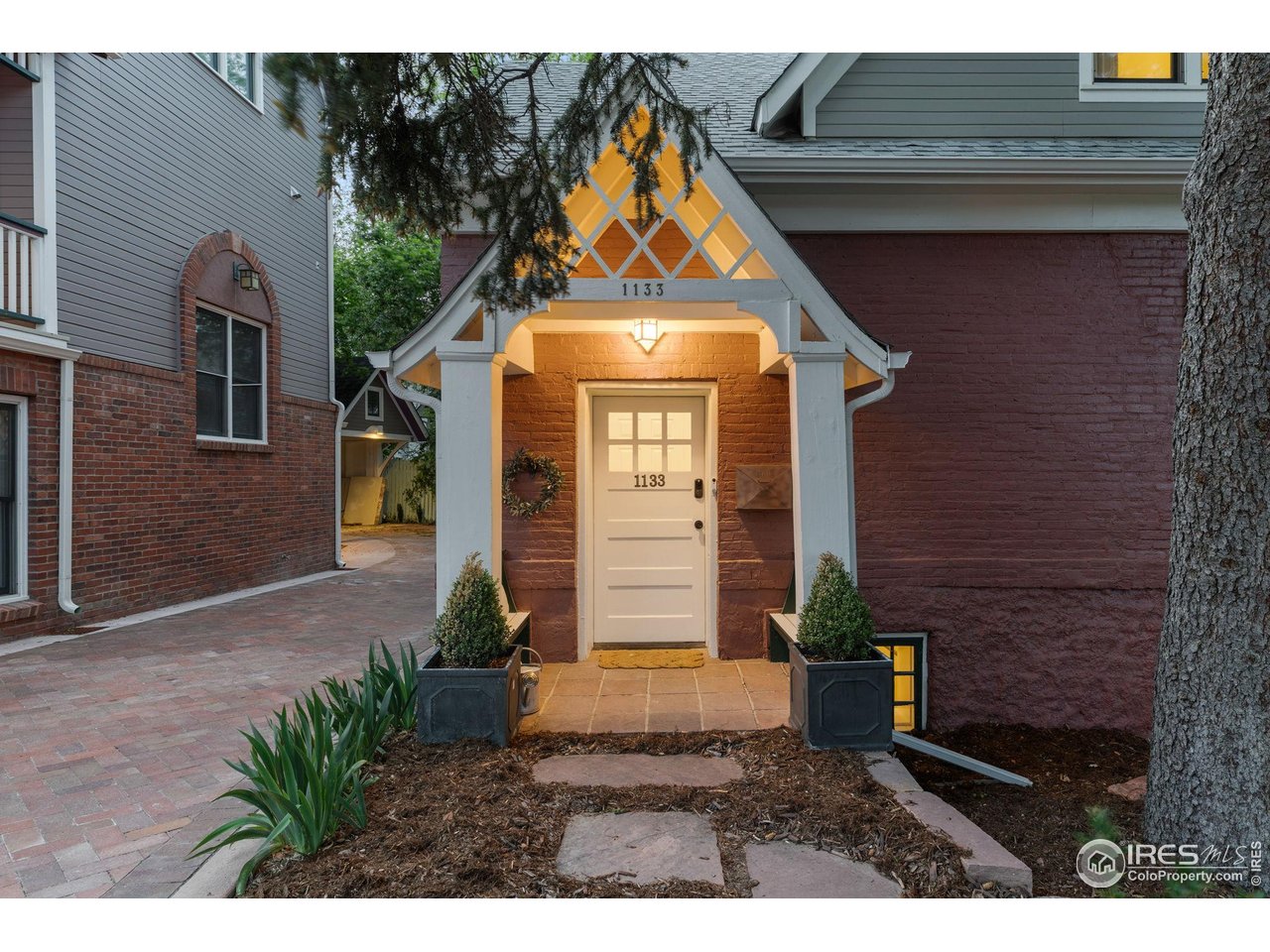 1133 Mapleton Avenue Boulder, CO 80304 - Photo 6 of 40 a front view of a house with garden
