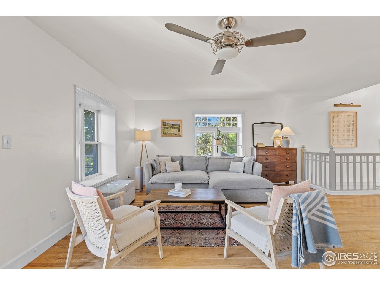 1133 Mapleton Avenue Boulder, CO 80304 - Photo 9 of 40 a living room with furniture a large window and a chandelier