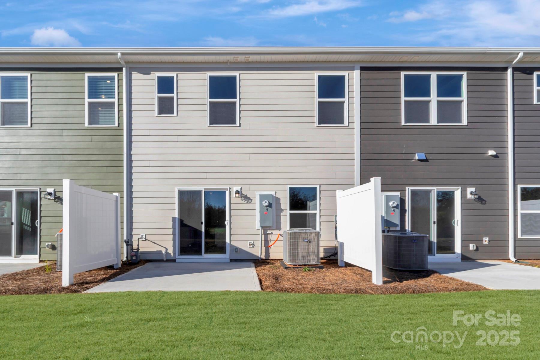 1129 Overbrook Place Wingate, NC 28174 - Photo 2 of 21 a front view of a house with a yard and garage