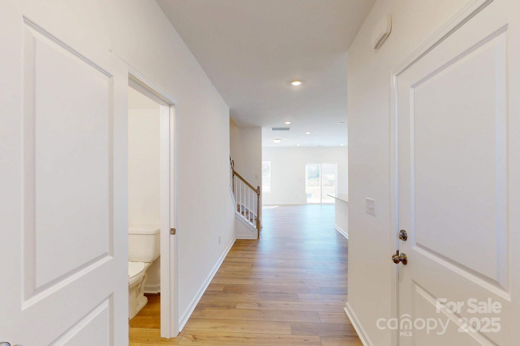 1129 Overbrook Place Wingate, NC 28174 - Photo 3 of 21 a view of a hallway with wooden floor