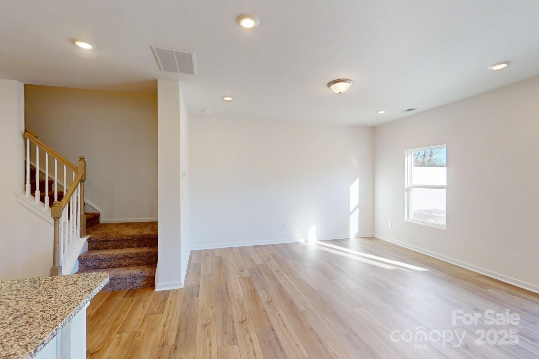 1129 Overbrook Place Wingate, NC 28174 - Photo 10 of 21 a view of entryway with wooden floor and stairs