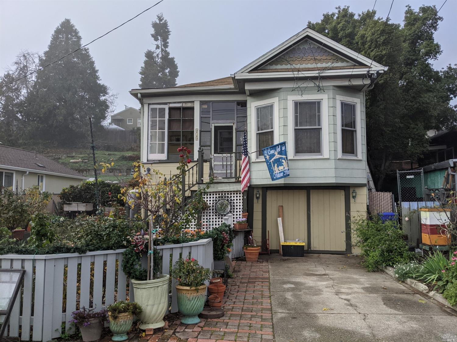 610 Rodeo Avenue Rodeo, CA 94572 - Photo 1 of 1 a front view of a house with plants
