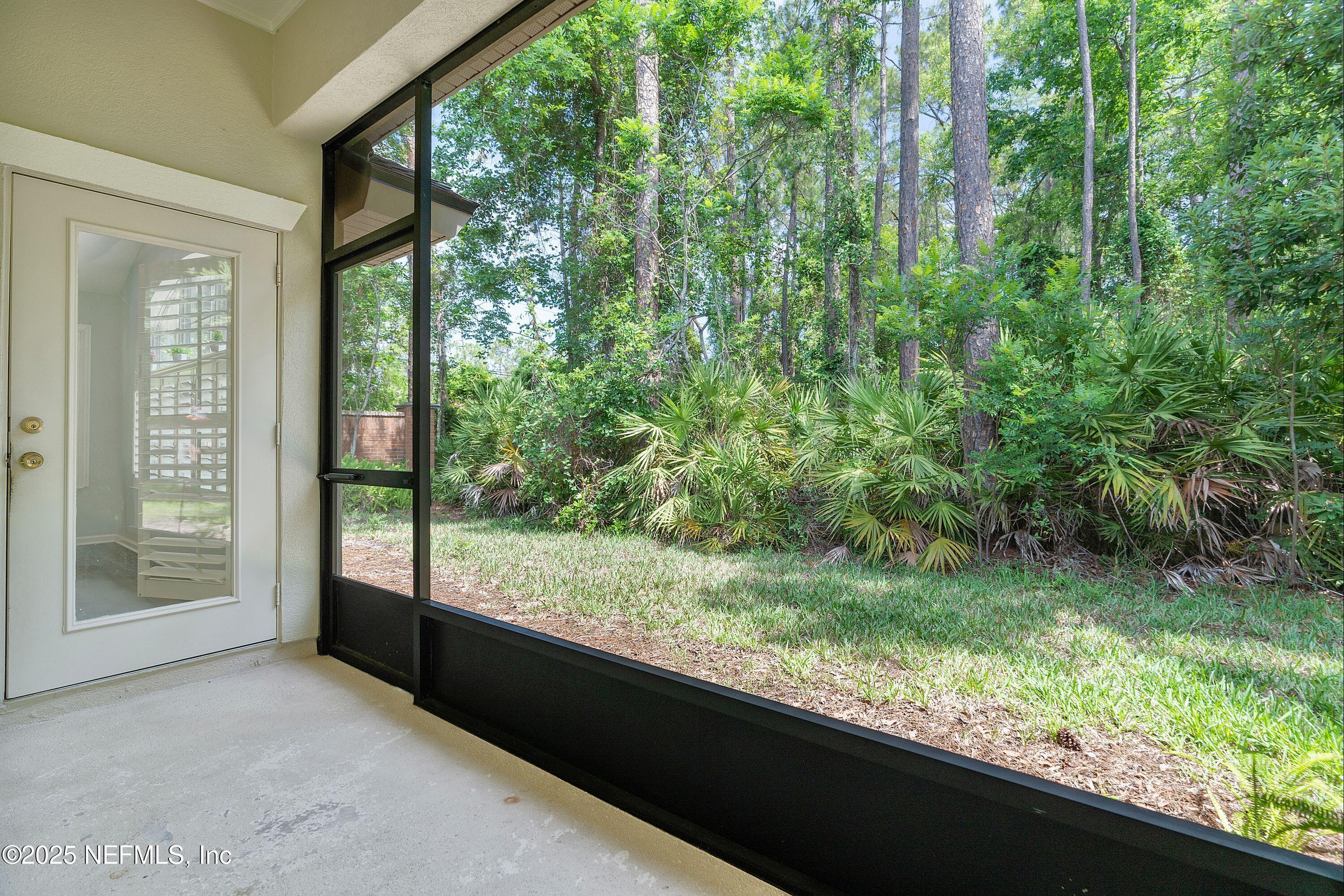 2120 Stone Creek Drive, Unit E Fleming Island, FL 32003 - Photo 17 of 66 a view of a garden from a window
