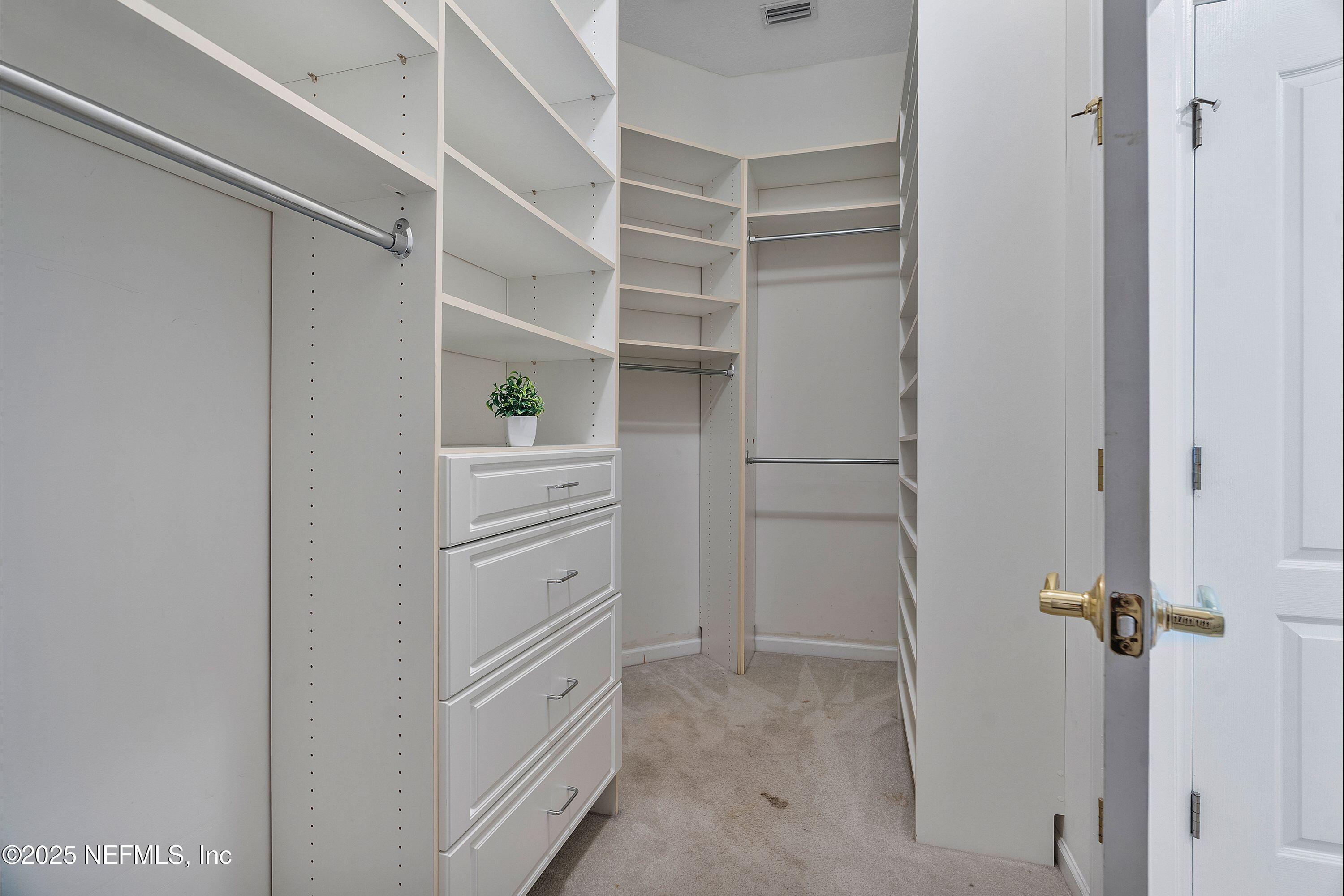 2120 Stone Creek Drive, Unit E Fleming Island, FL 32003 - Photo 23 of 66 a view of walk in closet