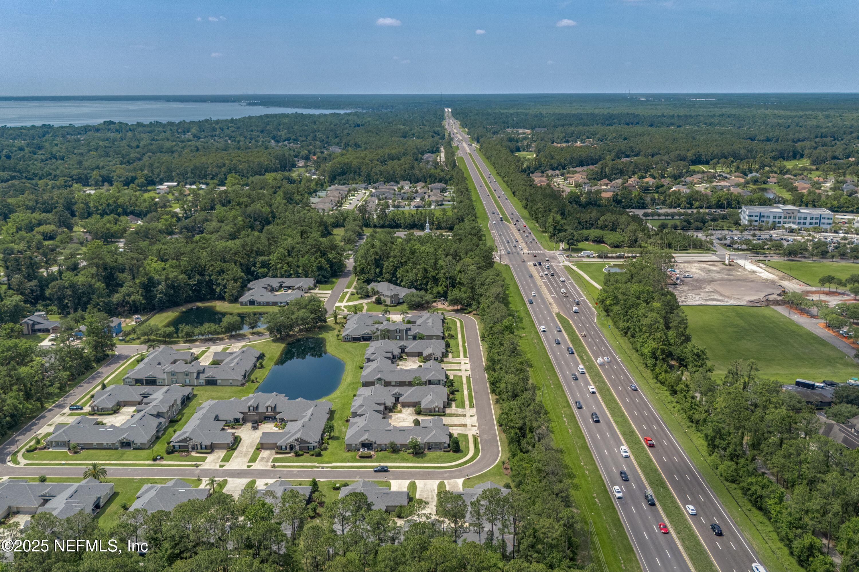 2120 Stone Creek Drive, Unit E Fleming Island, FL 32003 - Photo 39 of 66 a view of a lake with a yard