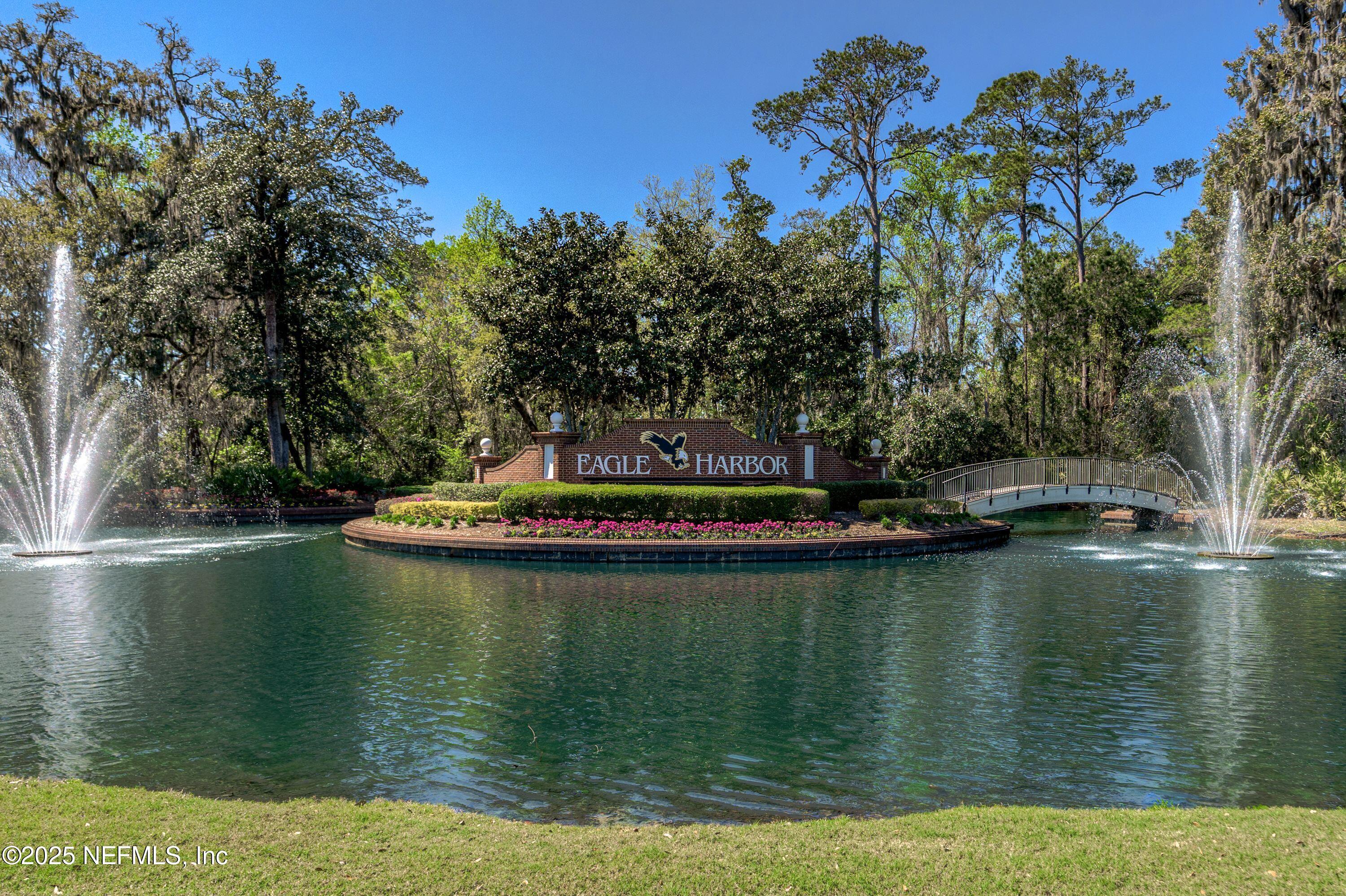 2120 Stone Creek Drive, Unit E Fleming Island, FL 32003 - Photo 44 of 66 a view of a lake with houses