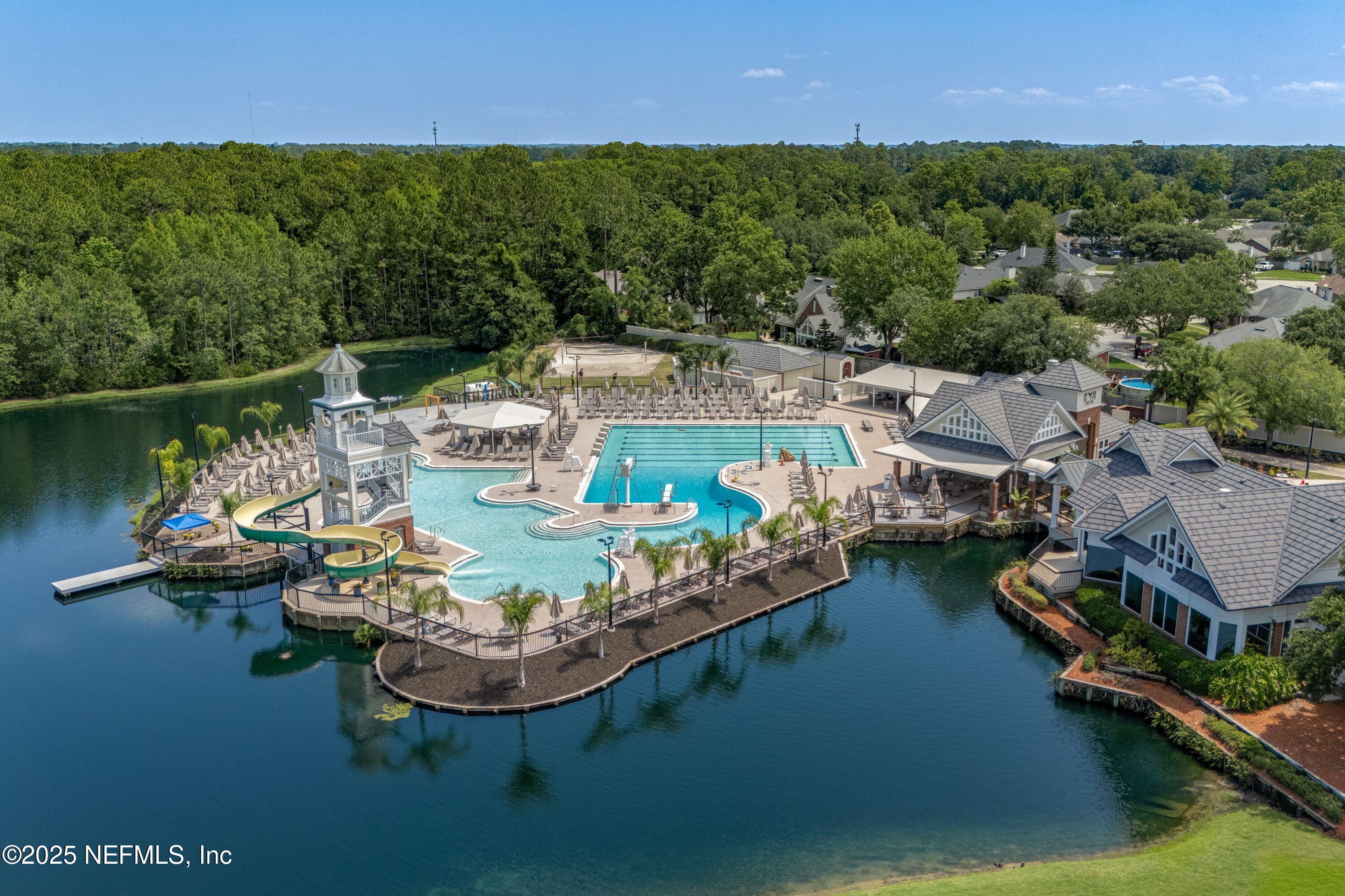 2120 Stone Creek Drive, Unit E Fleming Island, FL 32003 - Photo 47 of 66 an aerial view of a house with pool lake view and mountain view