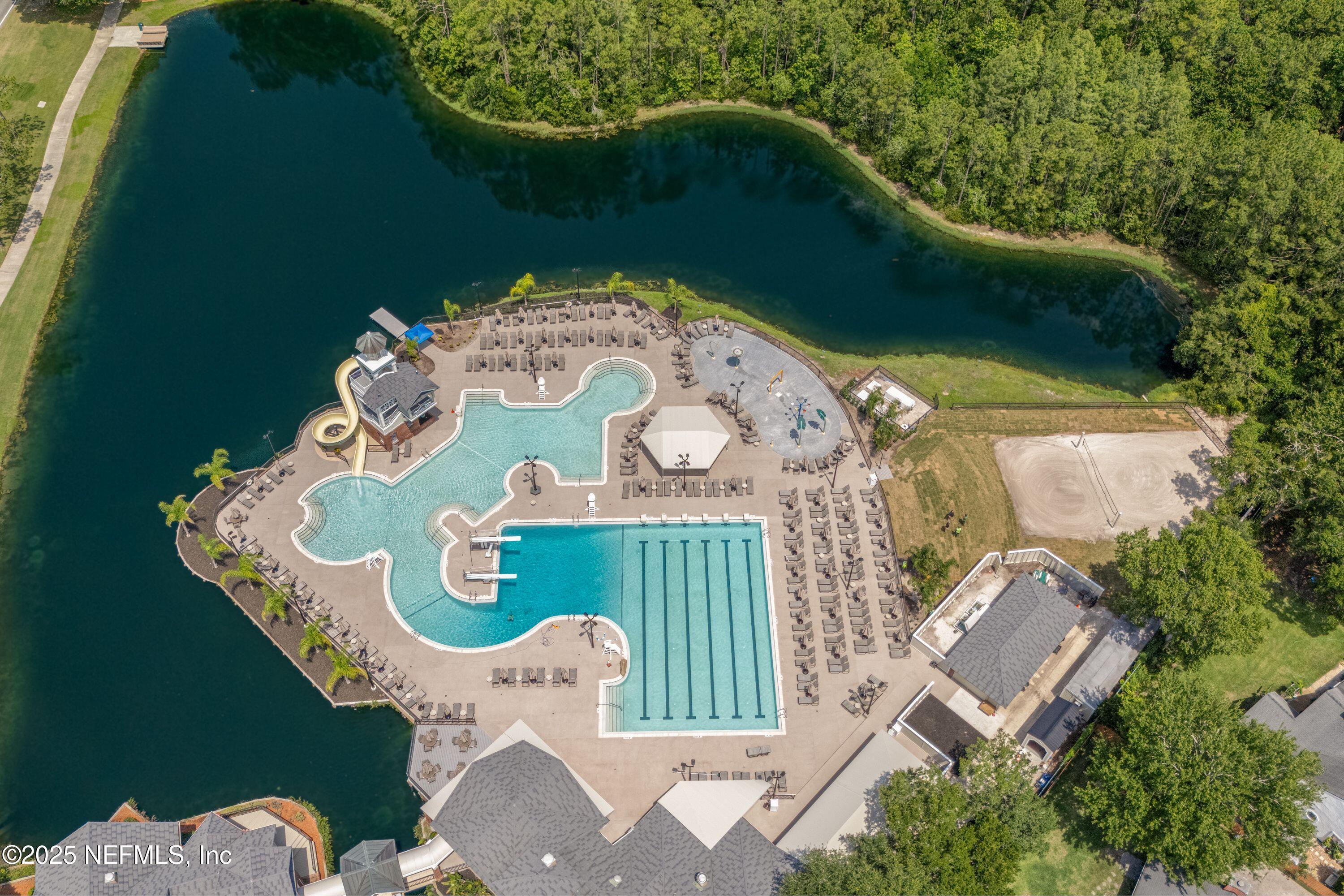 2120 Stone Creek Drive, Unit E Fleming Island, FL 32003 - Photo 49 of 66 an aerial view of a swimming pool with outdoor seating and yard