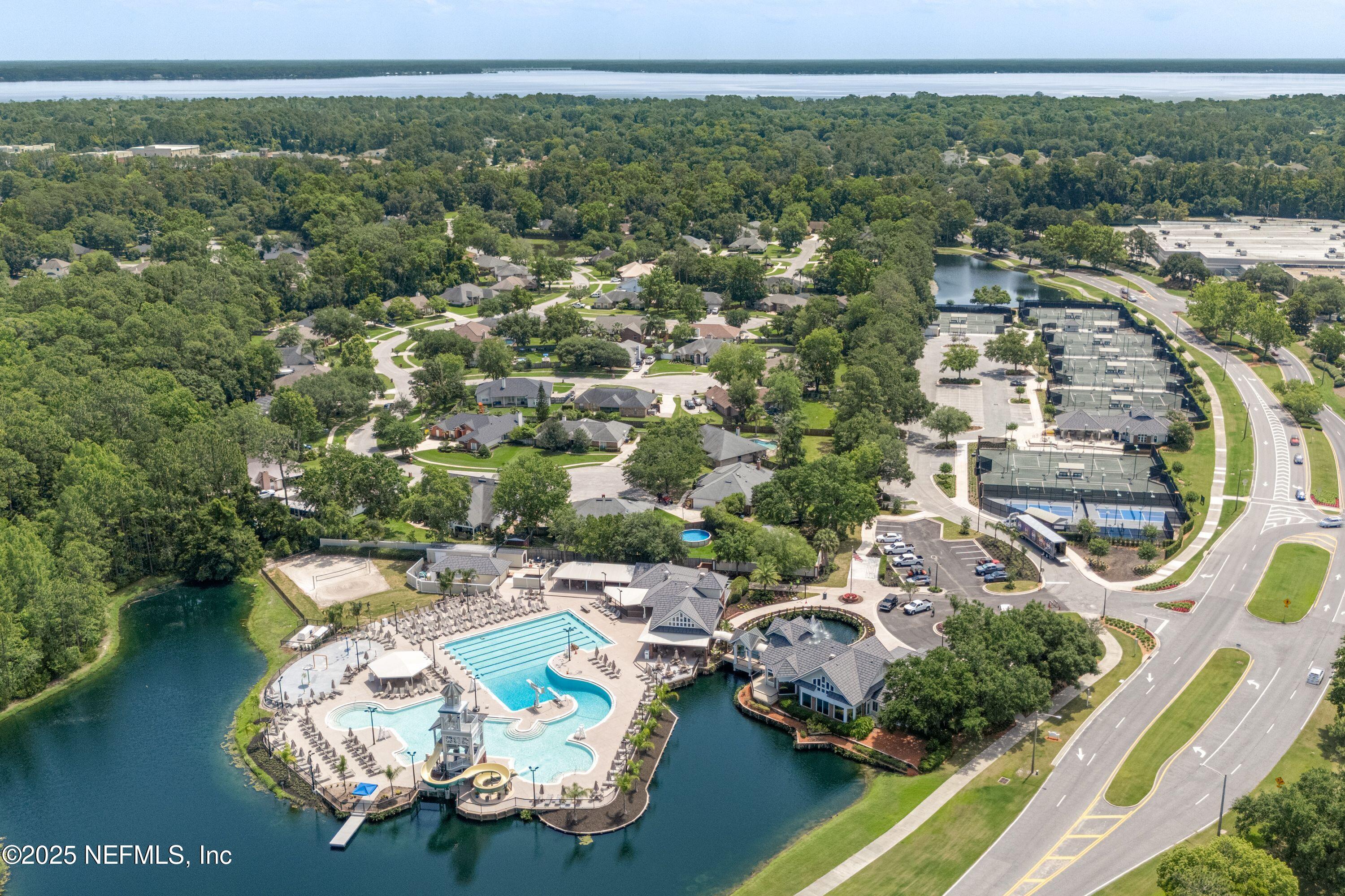 2120 Stone Creek Drive, Unit E Fleming Island, FL 32003 - Photo 50 of 66 an aerial view of a house with a lake view