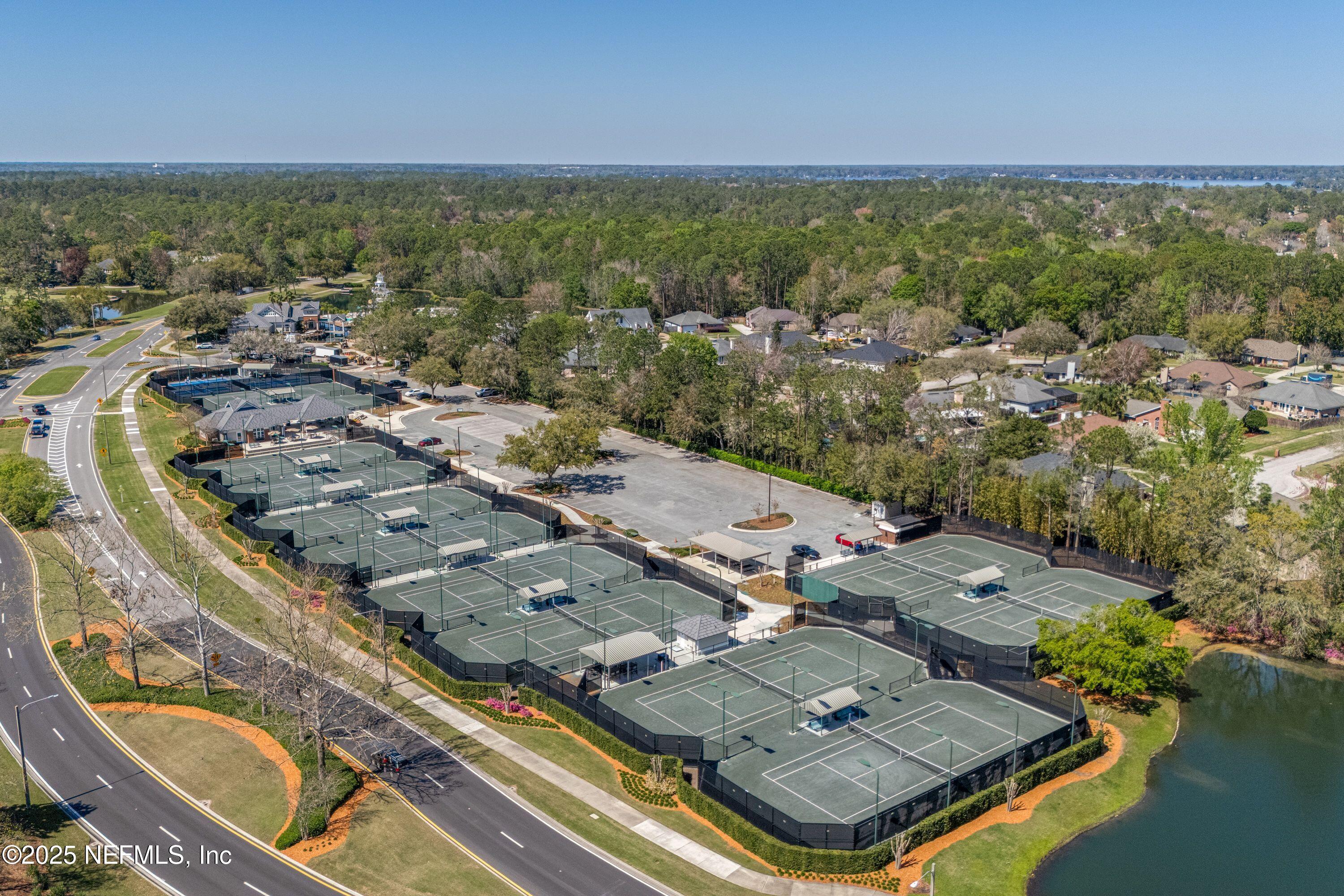 2120 Stone Creek Drive, Unit E Fleming Island, FL 32003 - Photo 51 of 66 an aerial view of residential houses with outdoor space