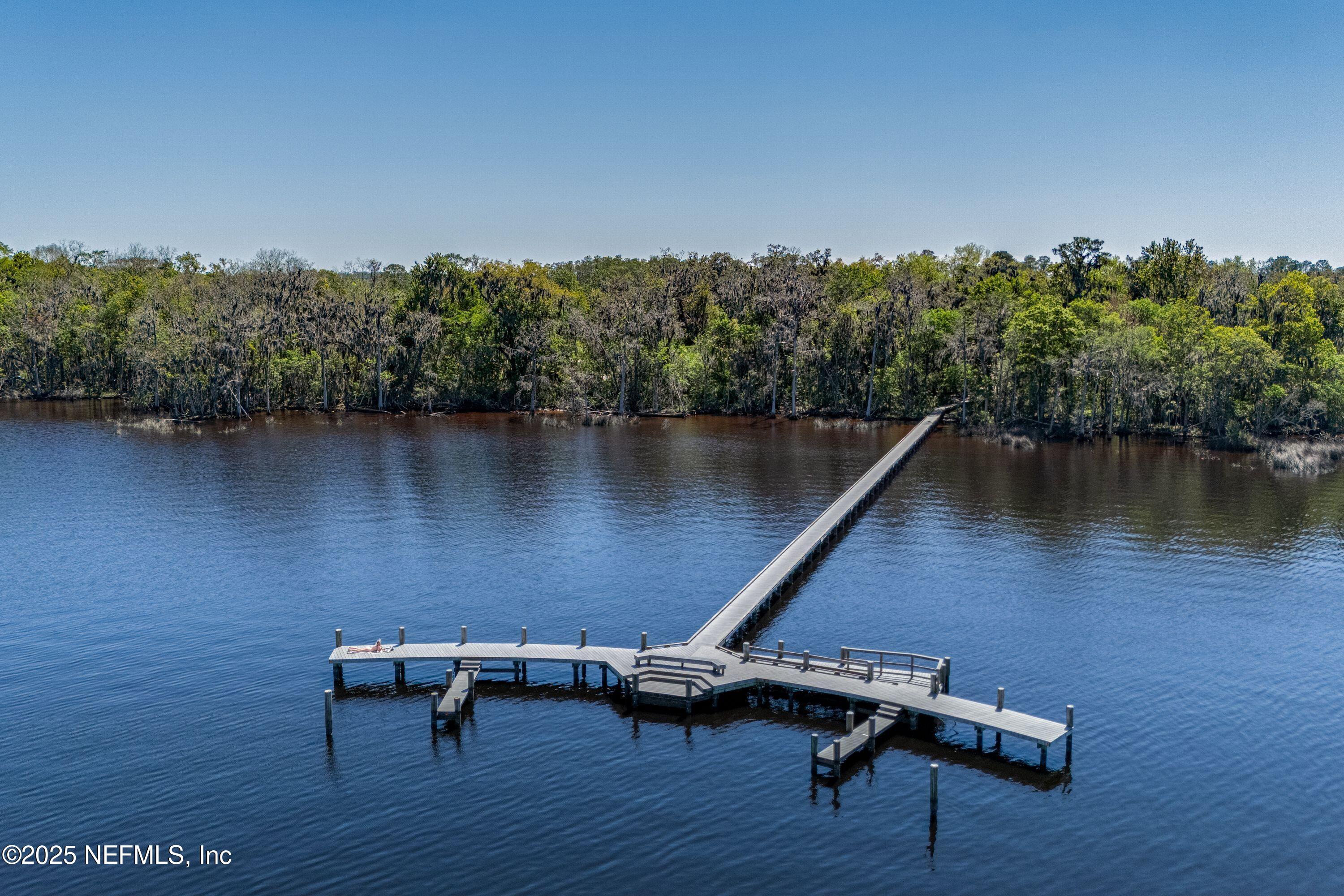 2120 Stone Creek Drive, Unit E Fleming Island, FL 32003 - Photo 57 of 66 a view of a lake with outdoor seating space