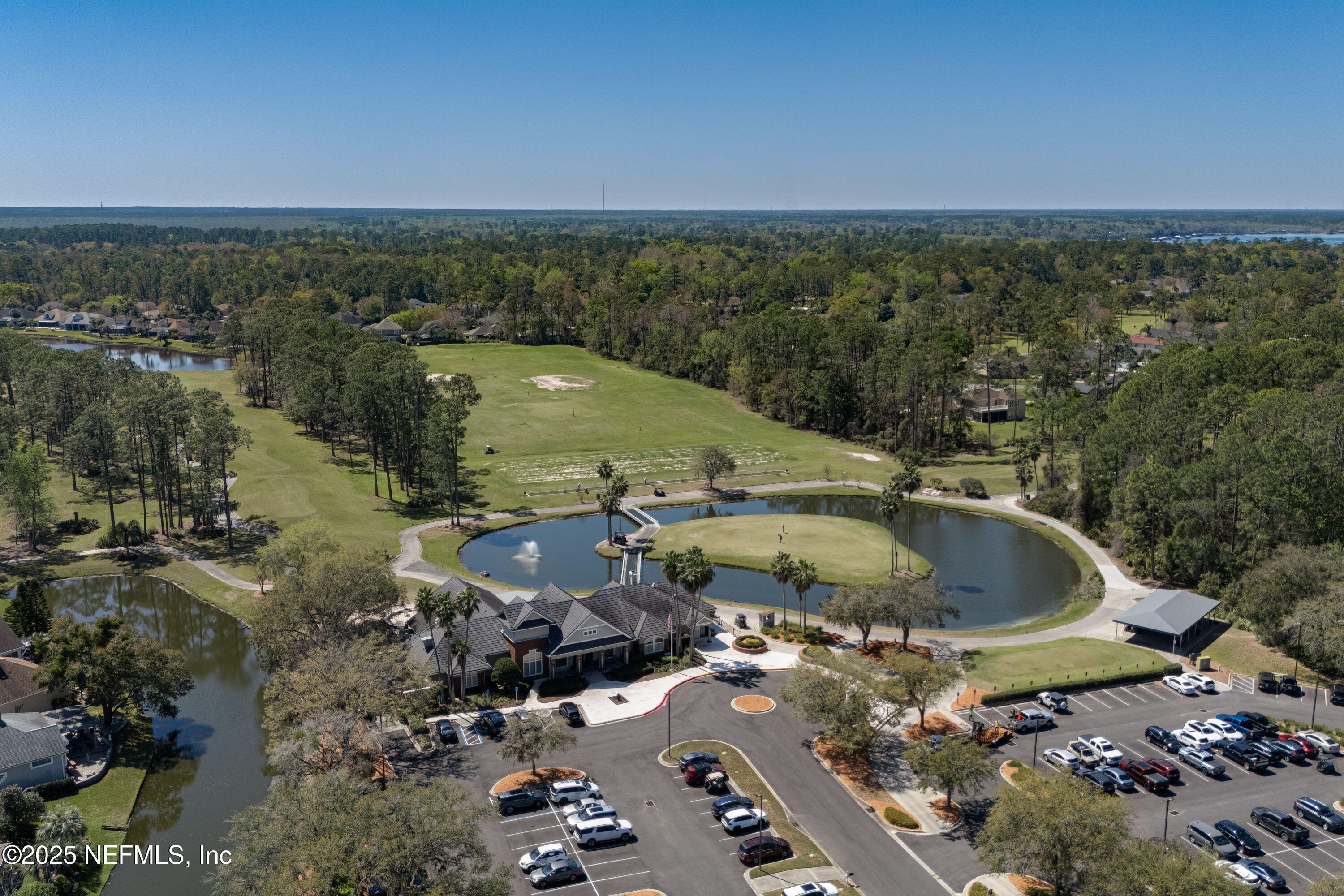 2120 Stone Creek Drive, Unit E Fleming Island, FL 32003 - Photo 59 of 66 a view of a swimming pool and lake view