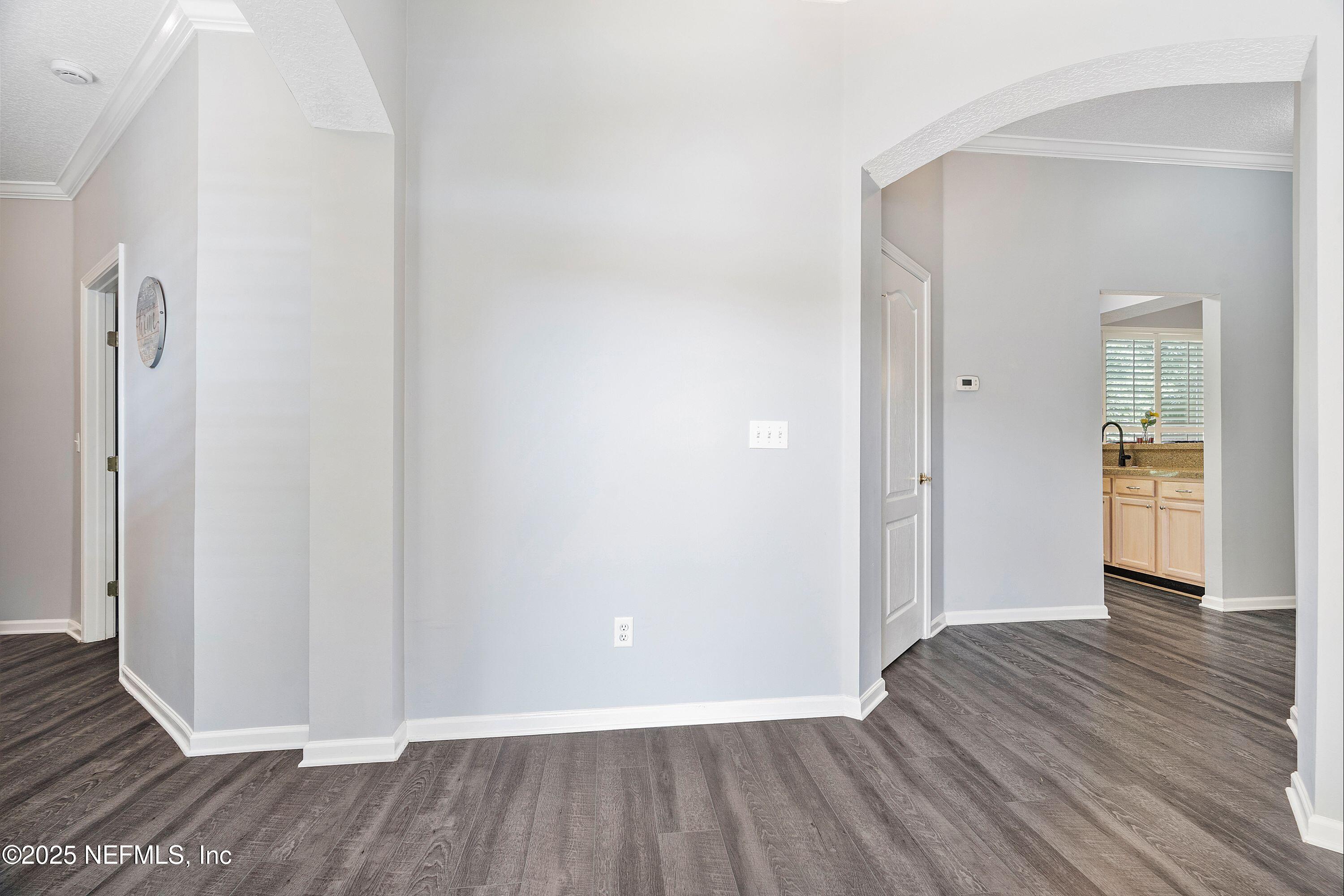 2120 Stone Creek Drive, Unit E Fleming Island, FL 32003 - Photo 6 of 66 a view of a hallway with wooden floor