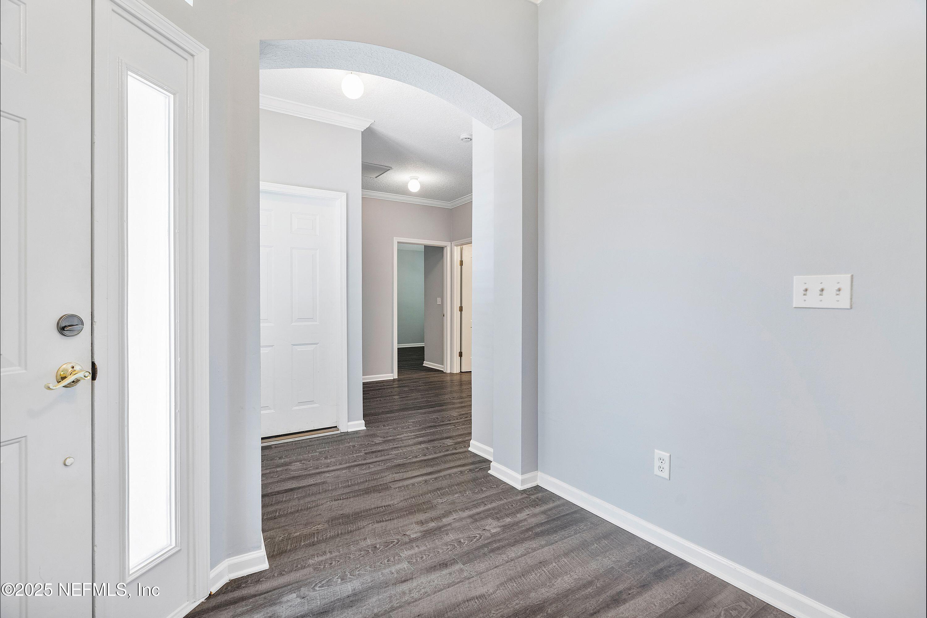 2120 Stone Creek Drive, Unit E Fleming Island, FL 32003 - Photo 9 of 66 a view of a hallway with wooden floor