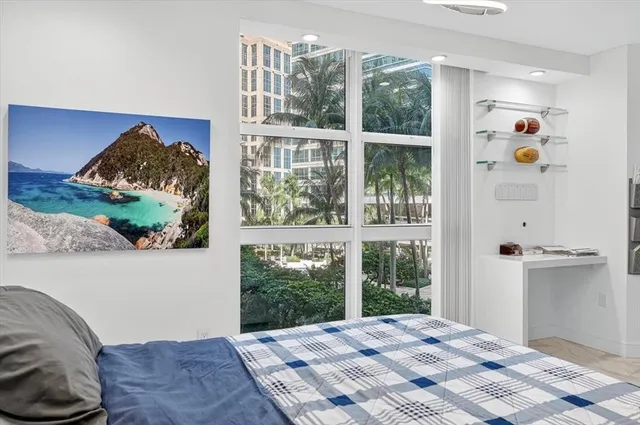 a bathroom with a tub sink toilet and a mirror