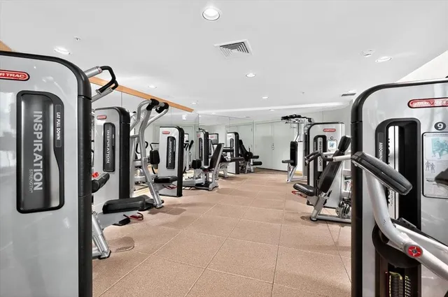 a view of gym equipment with large building