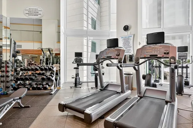 a room with wooden floor and furniture