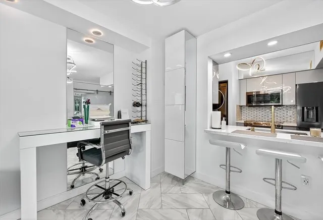 a bedroom with a bed and a cabinets