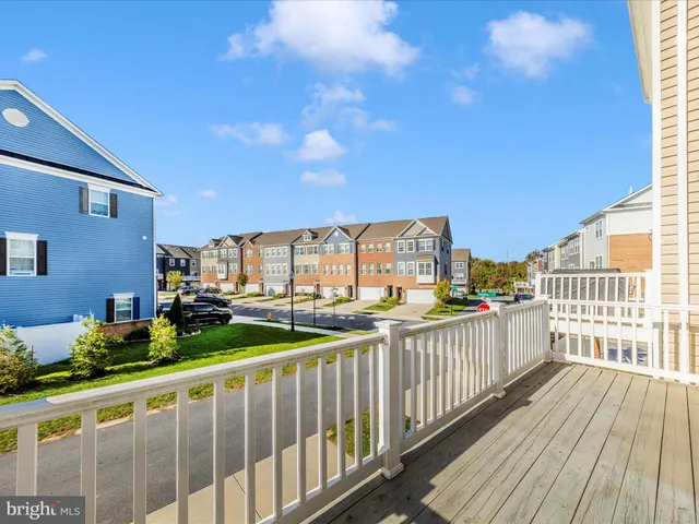 a view of swimming pool with outdoor seating and a yard