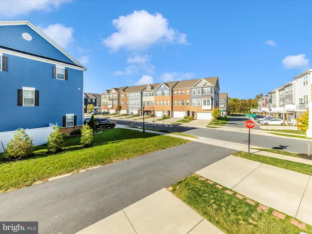 a living room with fireplace furniture and a large window