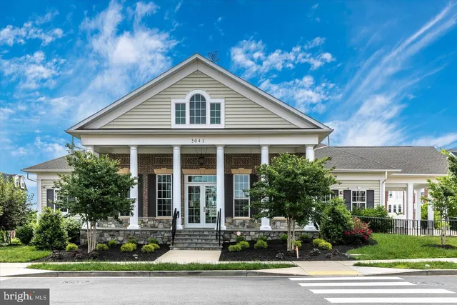 a living room with furniture or couch and a large window
