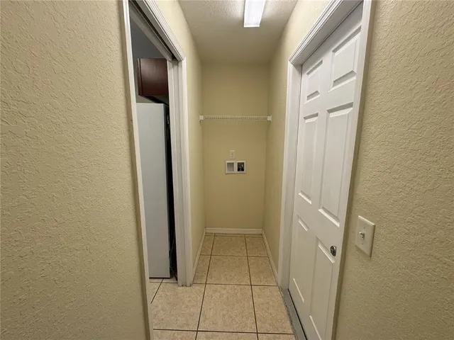 a bathroom with a granite countertop sink a mirror and a bathtub