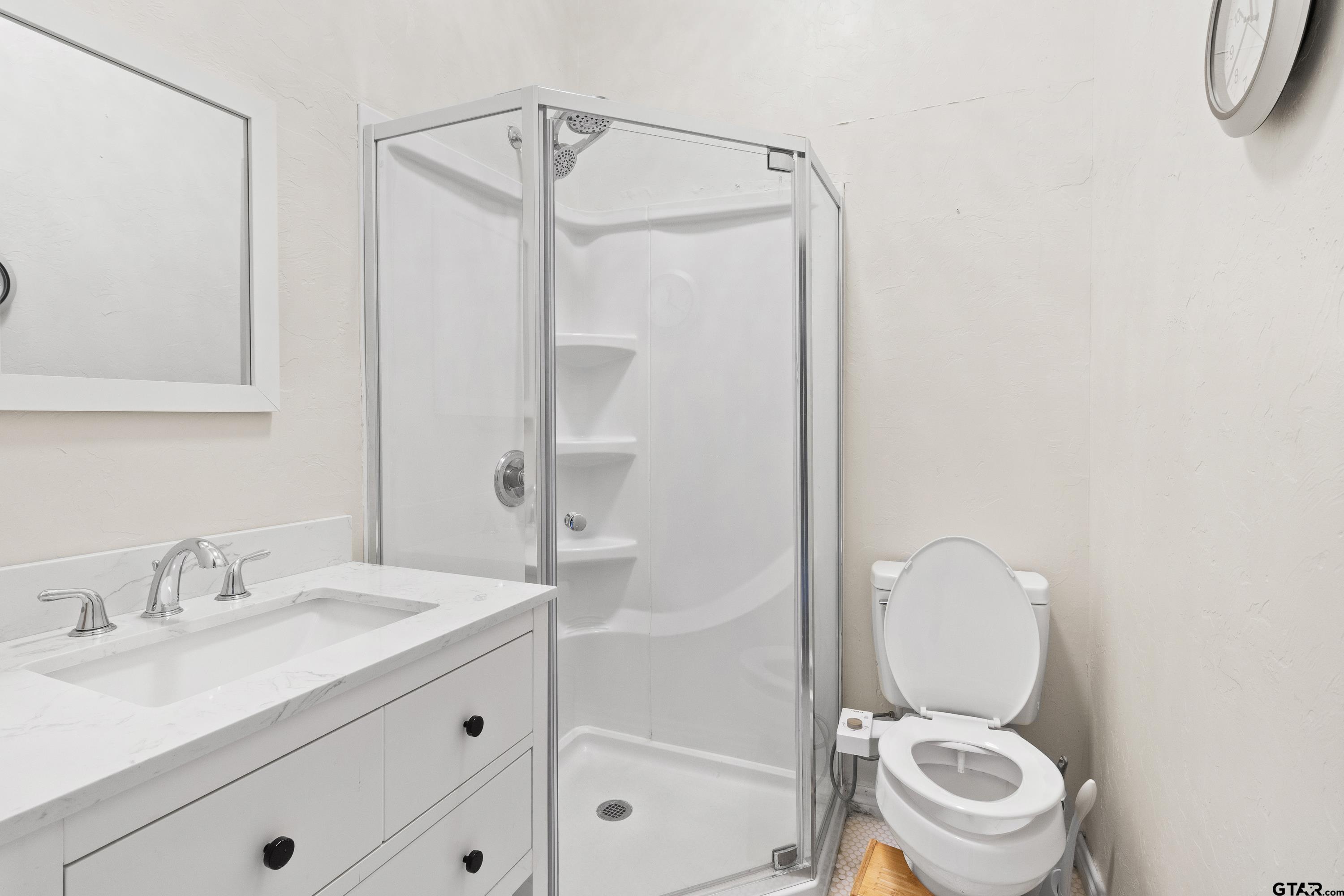 4456 Farm To Market Road 2767 Tyler, TX 75708 - Photo 21 of 46 a bathroom with a granite countertop sink toilet and shower