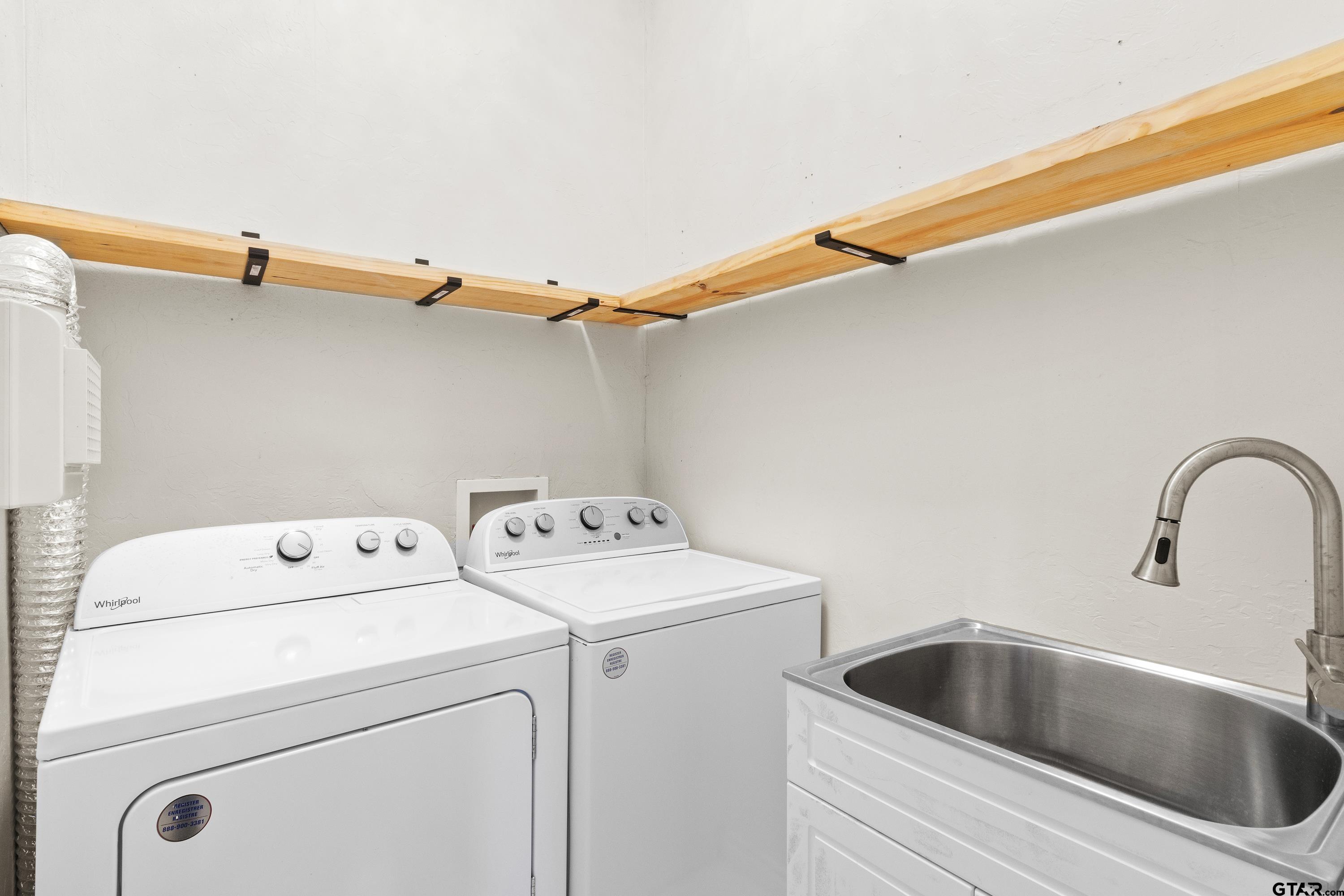 4456 Farm To Market Road 2767 Tyler, TX 75708 - Photo 34 of 46 a view of storage and utility room with washer and dryer