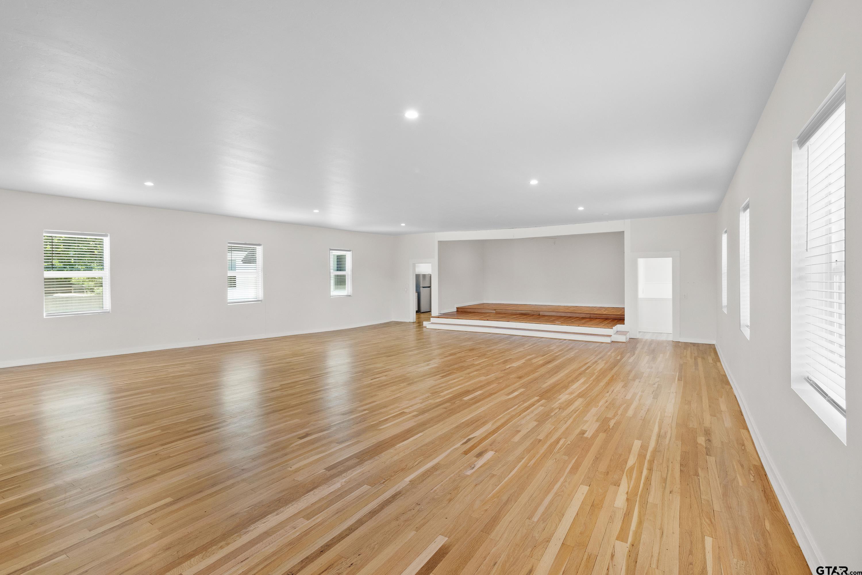 4456 Farm To Market Road 2767 Tyler, TX 75708 - Photo 40 of 46 a view of empty room with wooden floor and fan