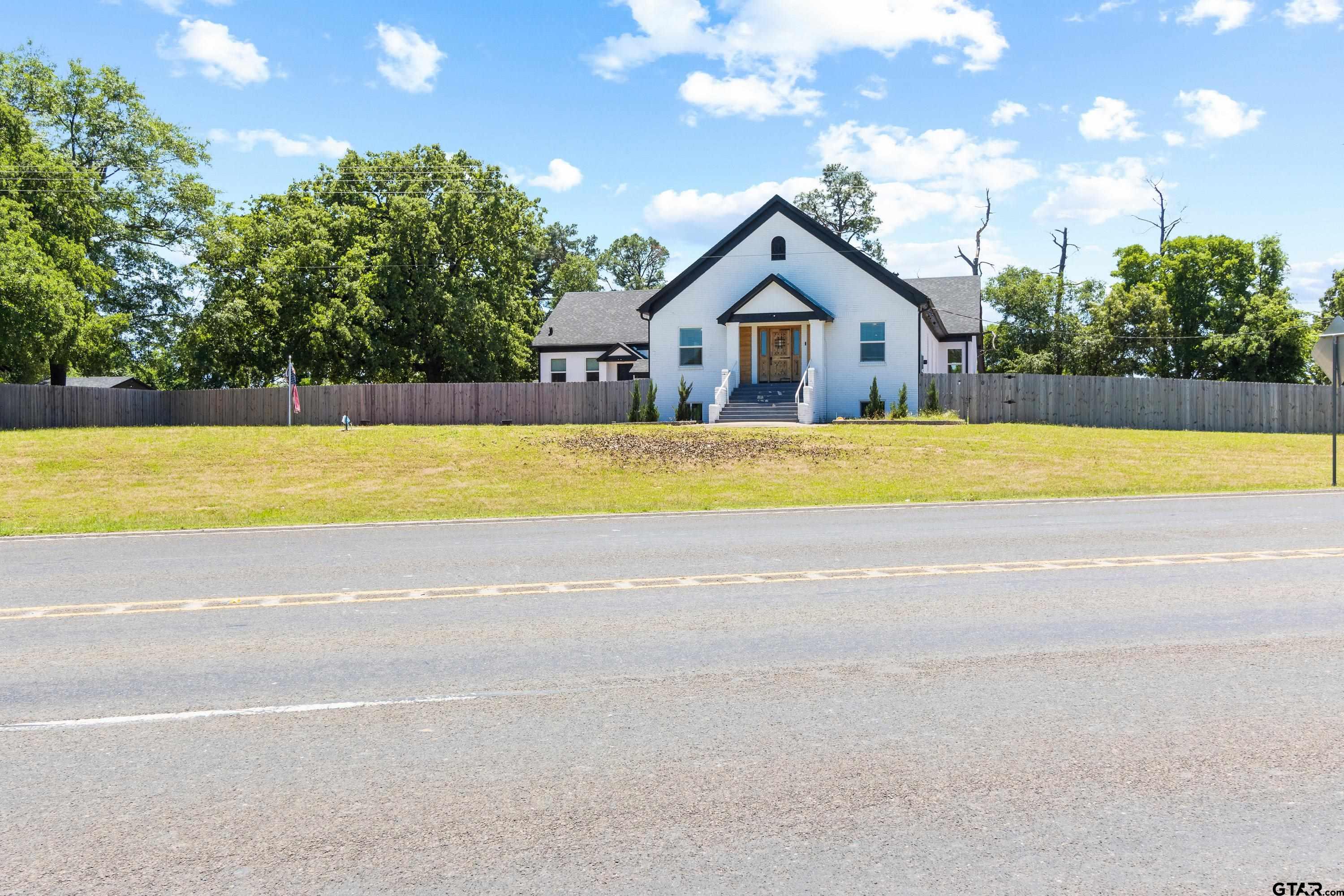 4456 Farm To Market Road 2767 Tyler, TX 75708 - Photo 4 of 46 a view of a house with a yard and a large tree