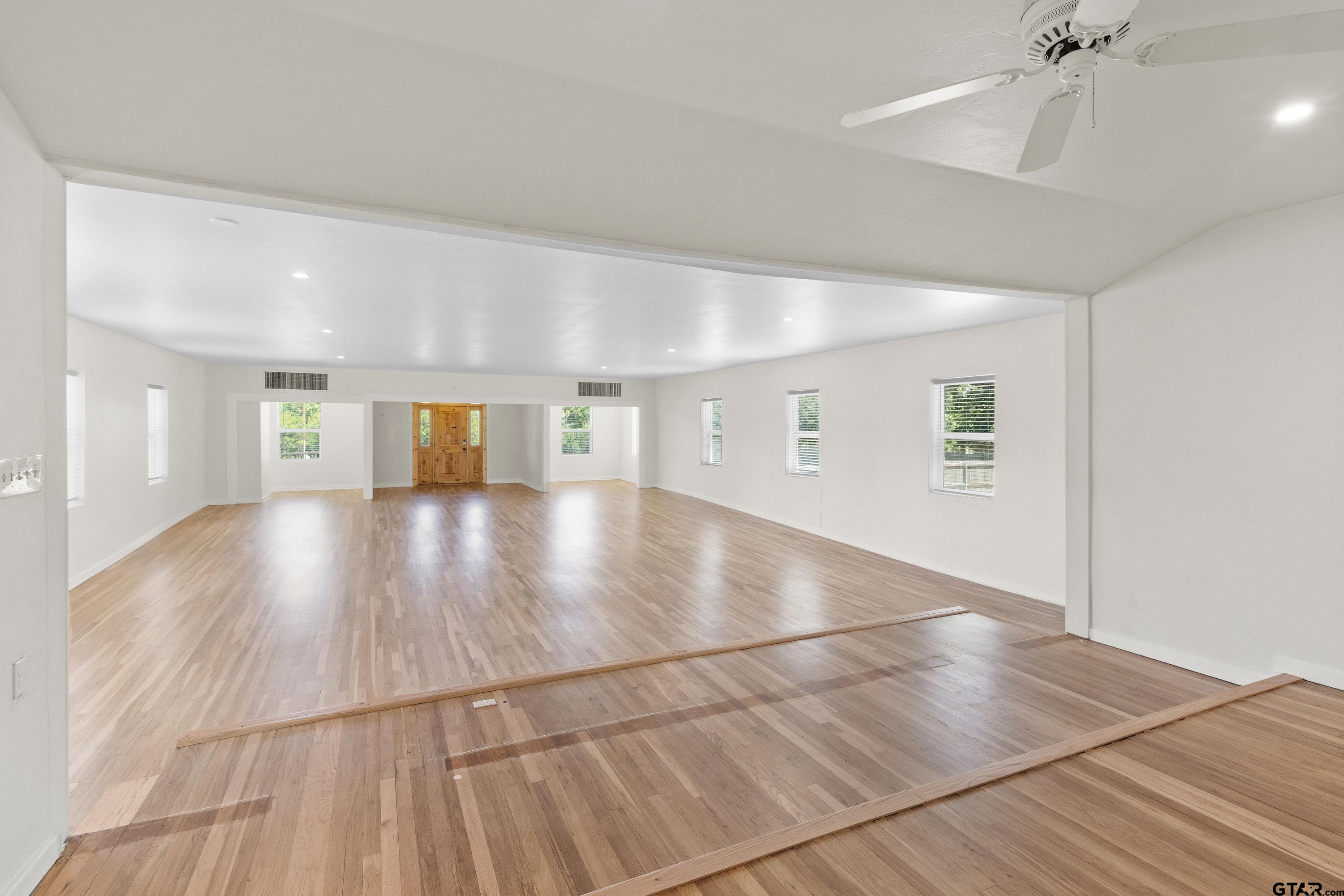 4456 Farm To Market Road 2767 Tyler, TX 75708 - Photo 42 of 46 a view of a hallway with wooden floor