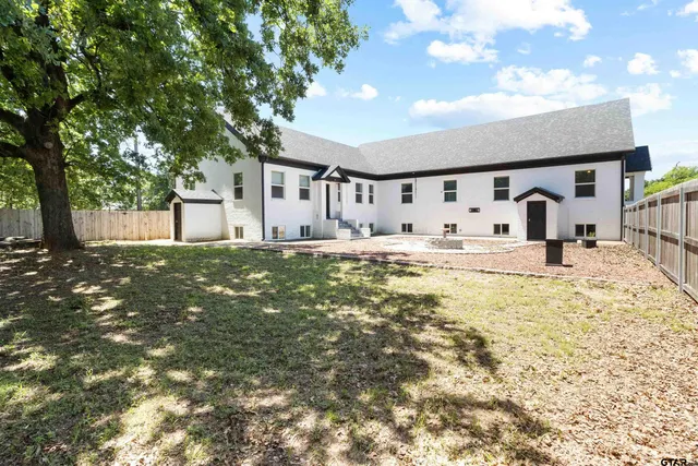a house with trees in front of it