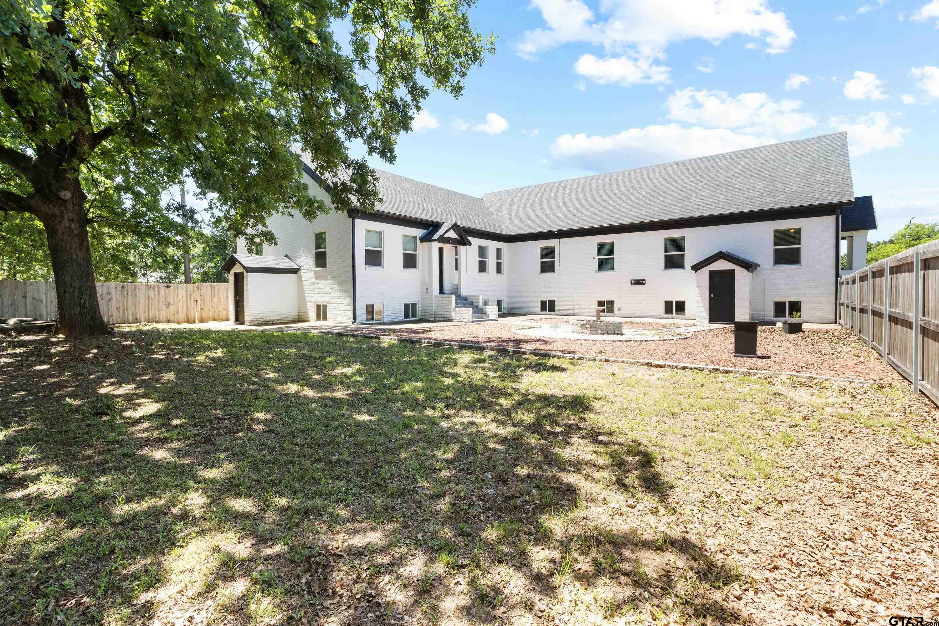 4456 Farm To Market Road 2767 Tyler, TX 75708 - Photo 5 of 46 a house with trees in front of it
