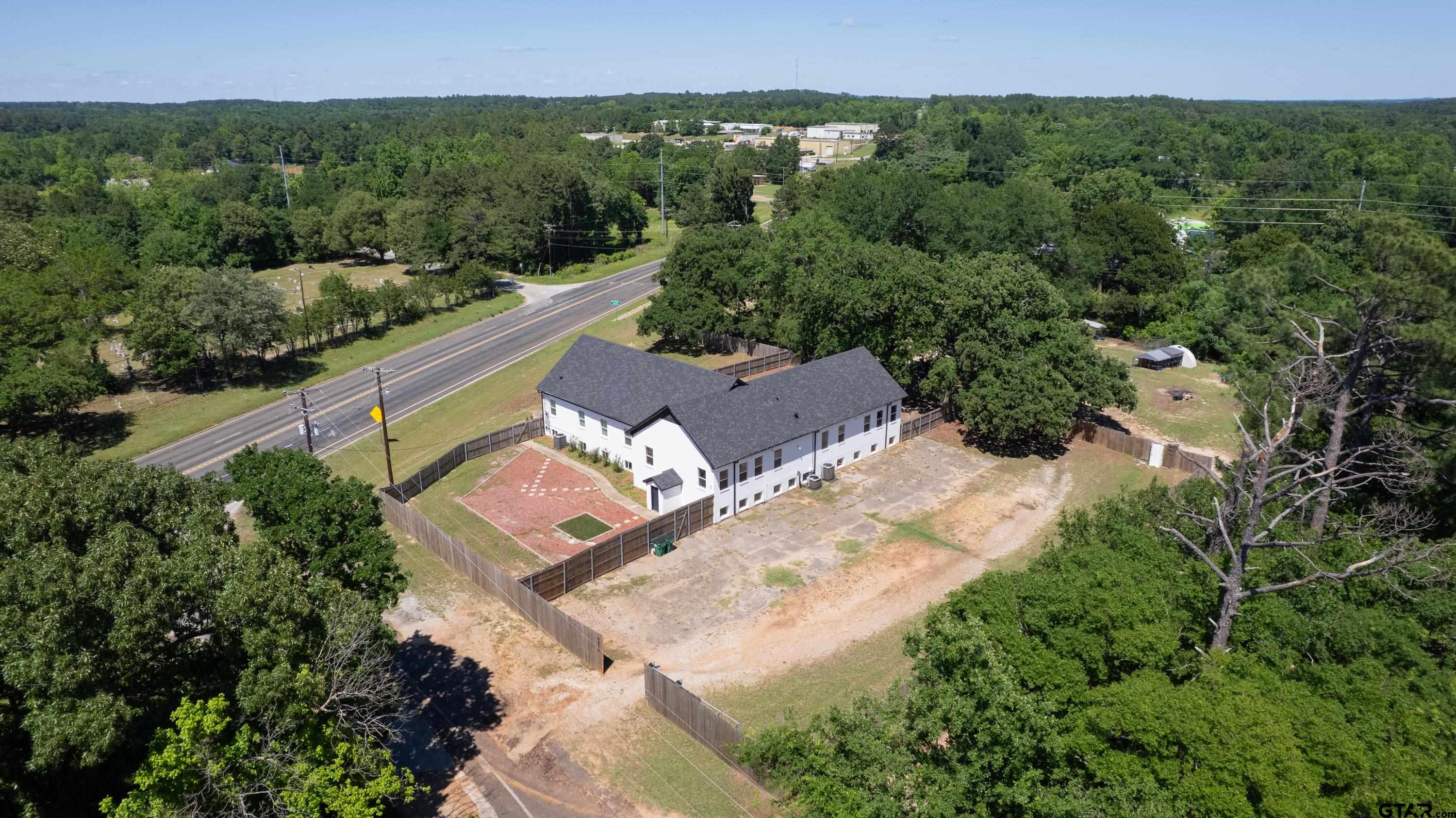 4456 Farm To Market Road 2767 Tyler, TX 75708 - Photo 10 of 46 an aerial view of a house with a yard