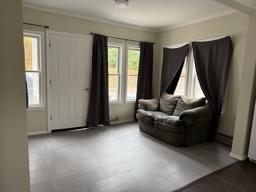 114 North Street Ware, MA 01082 - Photo 13 of 25 a living room with furniture and a window
