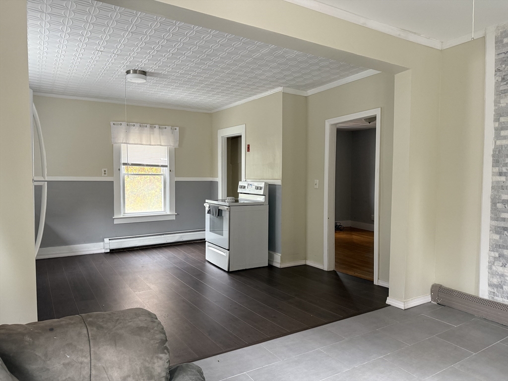 114 North Street Ware, MA 01082 - Photo 16 of 25 a view of a livingroom with wooden floor and a window