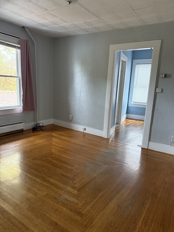 114 North Street Ware, MA 01082 - Photo 18 of 25 an empty room with wooden floor and windows