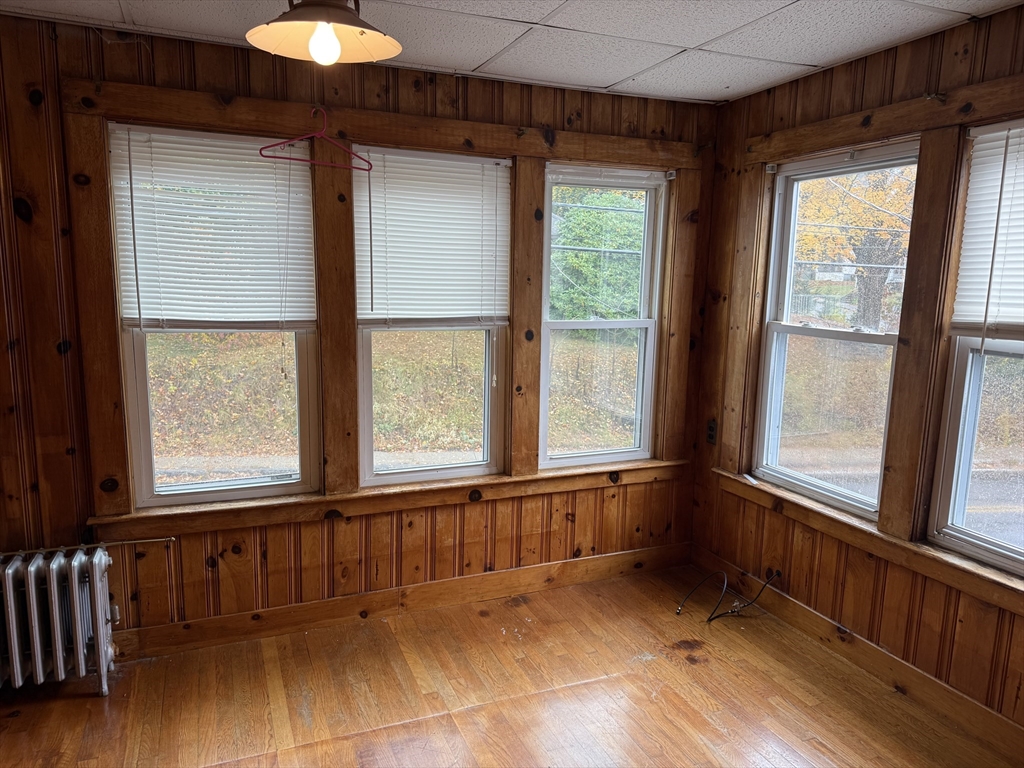 114 North Street Ware, MA 01082 - Photo 8 of 25 a view of an empty room with a window and wooden floor
