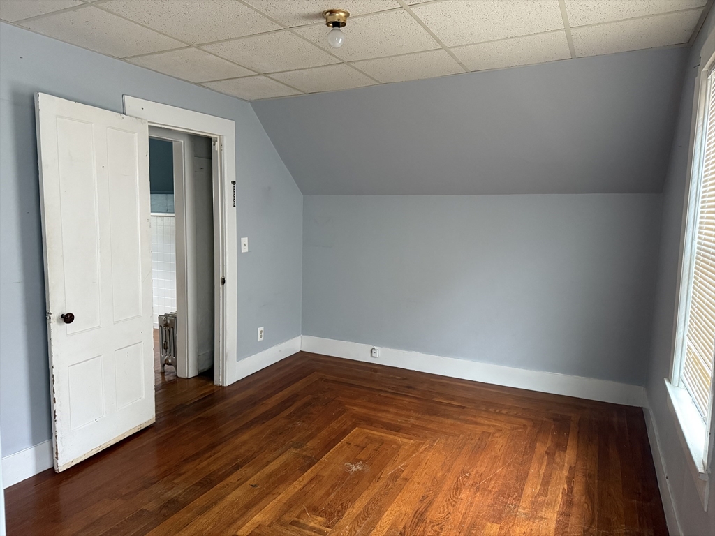 114 North Street Ware, MA 01082 - Photo 9 of 25 a view of an empty room with wooden floor and a window