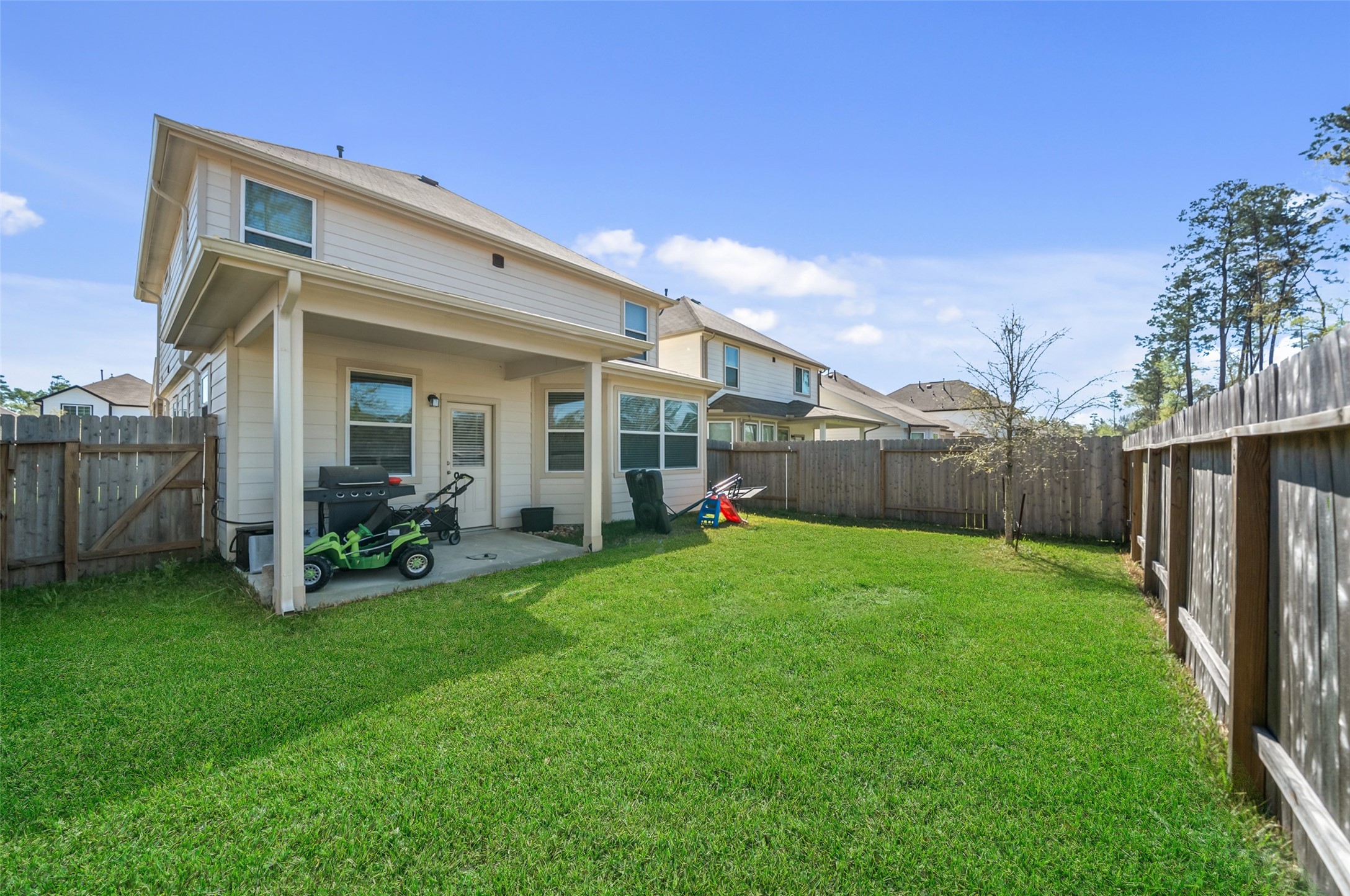 2302 Raider Drive Conroe, TX 77301 - Photo 24 of 25 a view of a house with backyard and porch