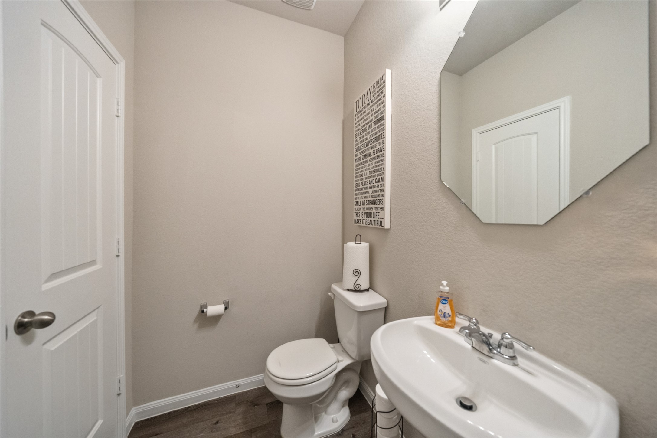 2302 Raider Drive Conroe, TX 77301 - Photo 10 of 25 a bathroom with a sink a toilet and mirror