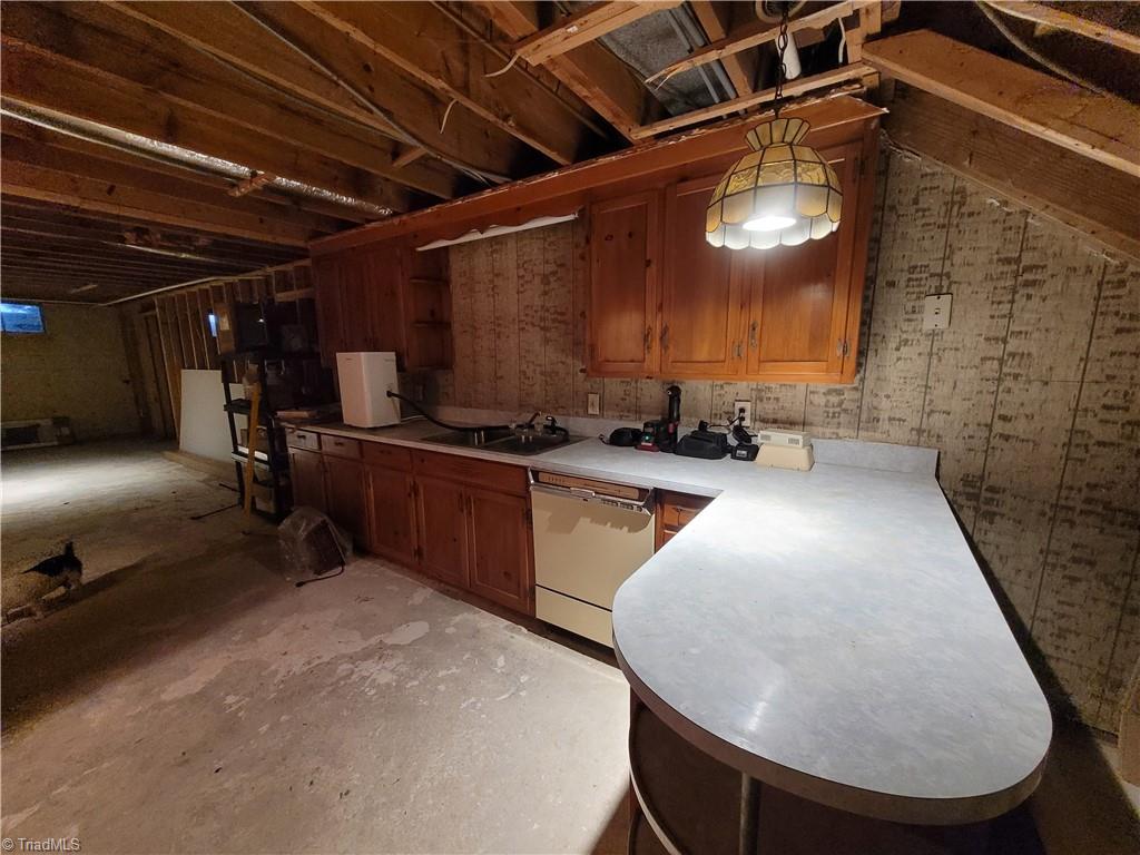 574 Hardin Camp Road Ennice, NC 28623 - Photo 45 of 50 Cabinetry in basement