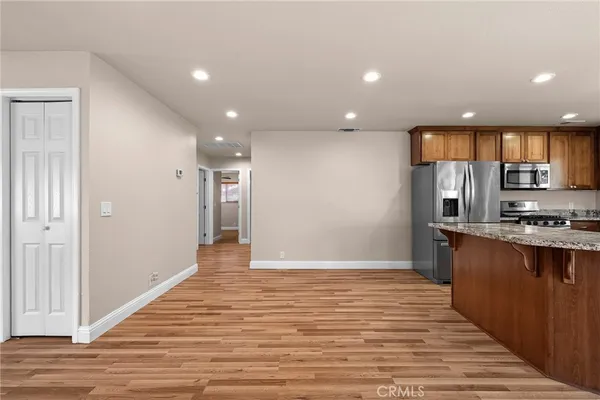 a bedroom with a bed and a potted plant