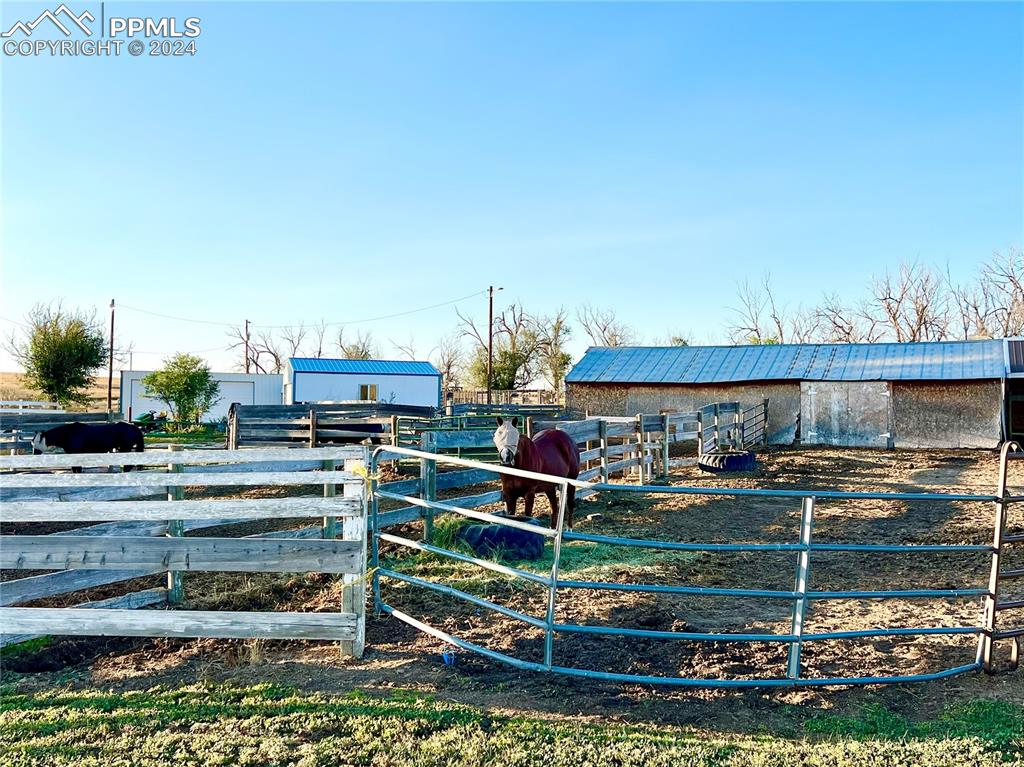 34650 Bellemont Road Yoder, CO 80864 - Photo 14 of 29 a front view of a house with a yard