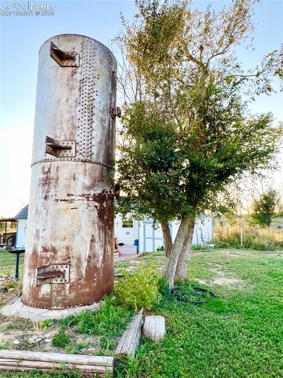 34650 Bellemont Road Yoder, CO 80864 - Photo 17 of 29 a front view of a house with garden