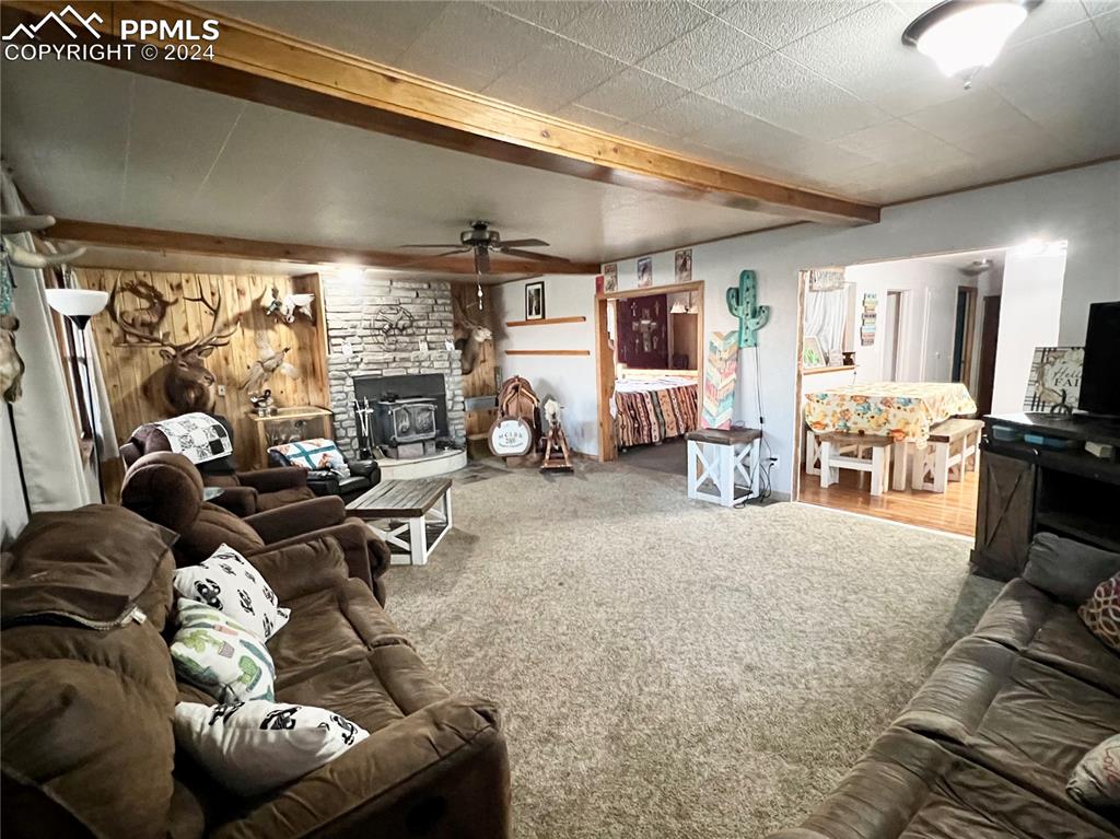 34650 Bellemont Road Yoder, CO 80864 - Photo 21 of 29 a living room with furniture and a large window
