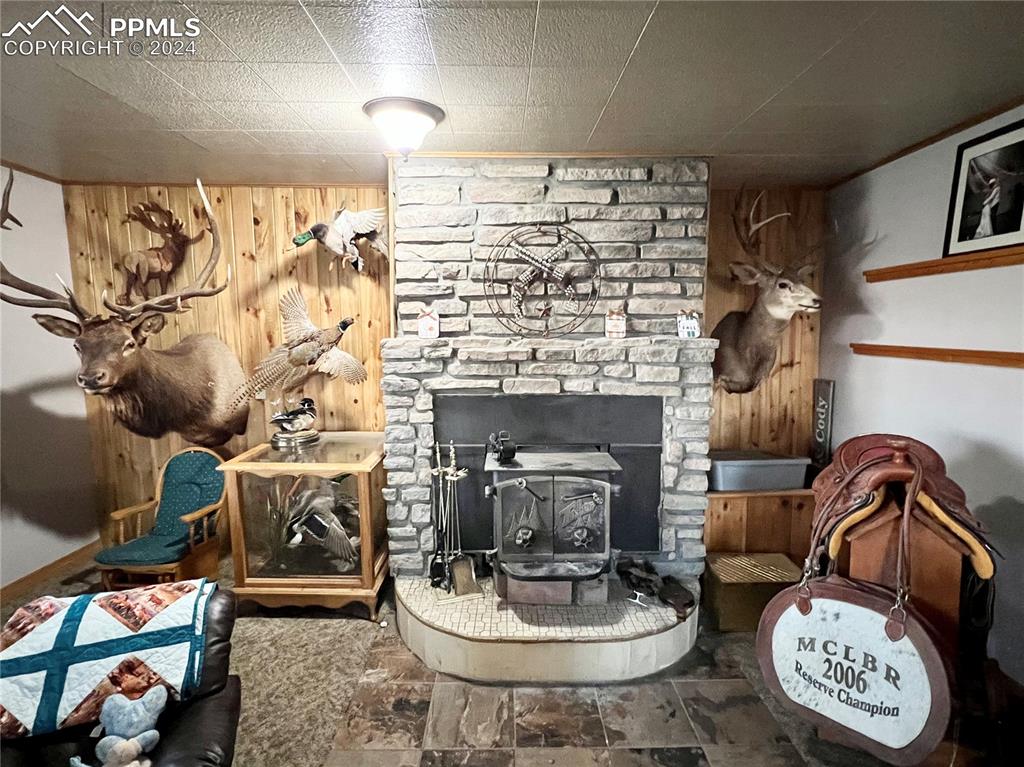 34650 Bellemont Road Yoder, CO 80864 - Photo 22 of 29 a living room with furniture and a fireplace
