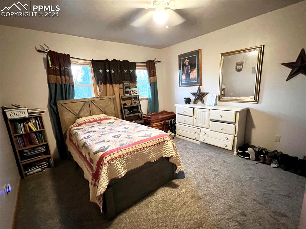 34650 Bellemont Road Yoder, CO 80864 - Photo 26 of 29 a bed room with a bed window and dresser