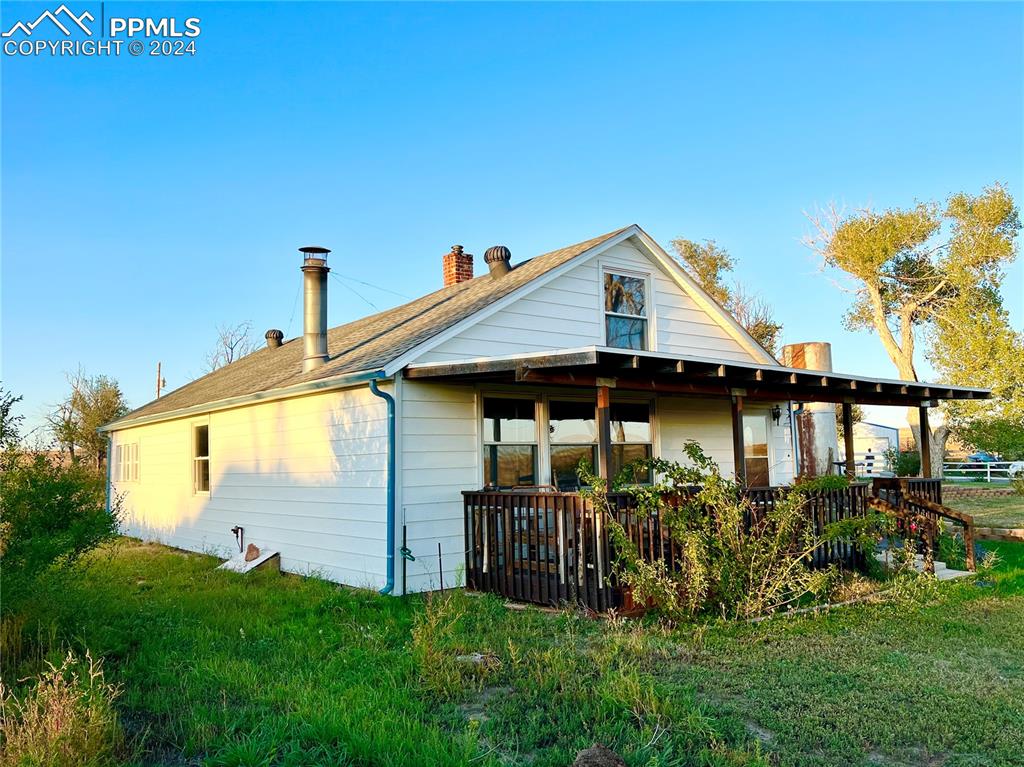 34650 Bellemont Road Yoder, CO 80864 - Photo 3 of 29 a front view of a house with garden