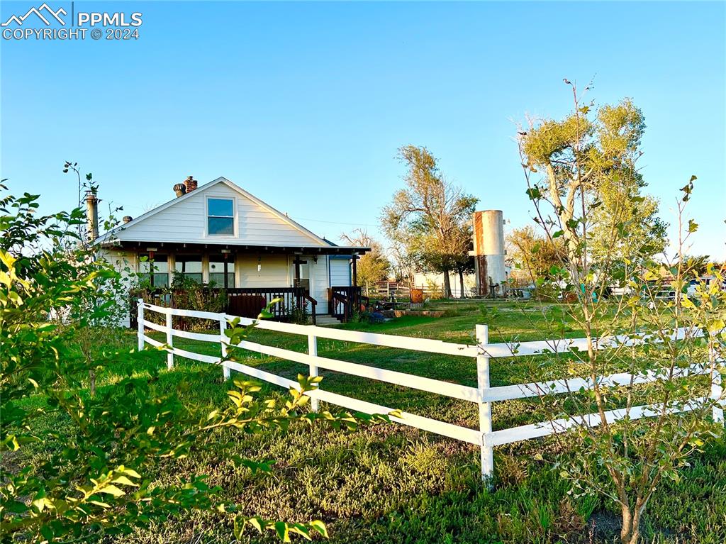 34650 Bellemont Road Yoder, CO 80864 - Photo 6 of 29 a view of a house with a yard